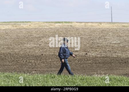 (190523) -- IOWA, May 23, 2019 (Xinhua) -- Bill Pellett walks along a field at his family farm in Atlantic of Cass county, Iowa, the United States, April 24, 2019. Bill Pellett knows how to farm, but just like most of his peers across the country, the 71-year-old farmer is feeling less assured of what he could get from a new year of farming, as there appears to be no quick resolution of the year-long trade disputes between the United States and China. TO GO WITH Spotlight: Leading U.S. farming state enters new crop season amid uncertainty over trade prospects with China (Xinhua/Wang Ying) U.S. Stock Photo