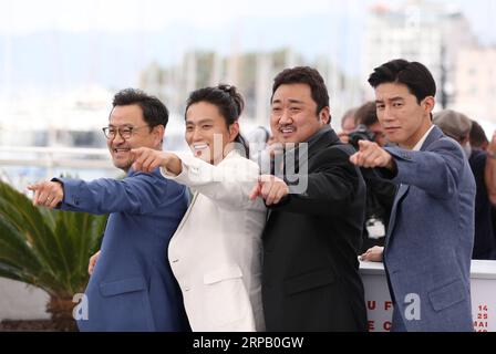 (190523) -- CANNES, May 23, 2019 (Xinhua) -- (L to R) Director Lee Won-tae, actors Kim Sung-Kyu, Ma Dong-Seok and Kim Moo-Yul pose during a photocall for The Gangster, The Cop, The Devil at the at the 72nd Cannes Film Festival in Cannes, France, May 23, 2019. (Xinhua/Gao Jing) FRANCE-CANNES-FILM FESTIVAL- THE GANGSTER, THE COP, THE DEVIL PUBLICATIONxNOTxINxCHN Stock Photo