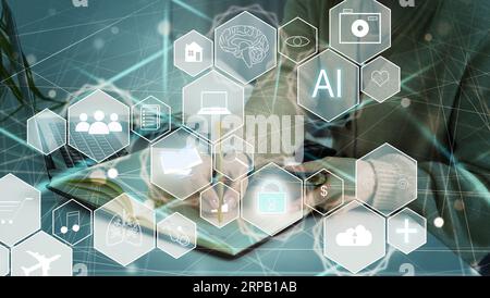 Artificial Intelligence AI, Internet of Things IoT. Business man using laptop computer on technology background, big data, deep learning, smart phone Stock Photo