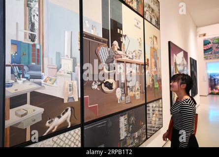 (190525) -- CHONGQING, May 25, 2019 (Xinhua) -- A visitor looks at an exhibit at a graduation exhibition of graduates from Sichuan Fine Arts Institute in Chongqing, southwest China, May 24, 2019. More than 10,000 pieces (sets) of works were displayed at the exhibition. (Xinhua/Wang Quanchao) CHINA-CHONGQING-ARTS-GRADUATES-EXHIBITION (CN) PUBLICATIONxNOTxINxCHN Stock Photo