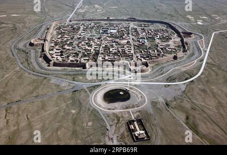 (190529) -- BEIJING, May 29, 2019 (Xinhua) -- Aerial photo taken on May 28, 2019 shows a view of the Yongtai ancient city in Jingtai County of Baiyin, northwest China s Gansu Province. Construction of the Yongtai ancient city began in the early 17th century and the complex used to be a military fortress. The ancient wall circling the city stretches for more than 1,700 meters, with a height of 12 meters. The Yongtai ancient city looks like a turtle when seen from above and is thus dubbed the turtle city . In 2006, it was listed as a state-level key cultural relics protection unit. (Xinhua/Ma Ni Stock Photo