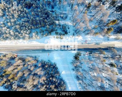 (190530) -- HARBIN, May 30, 2019 (Xinhua) -- Aerial photo taken on Dec. 16, 2018 shows the snow scenery of China s northernmost Beiji Village in Mohe City, northeast China s Heilongjiang Province. Located in northeast China, Heilongjiang Province is widely-known for its distinct seasons and its endeavor to promote ecological development, especially in the Greater and Lesser Khingan Mountains. The forest area in the Khingan Mountains, which is regarded as an important forest eco-function zone and a reserve of strategic significance for timber resources in China, plays an irreplaceable role in m Stock Photo