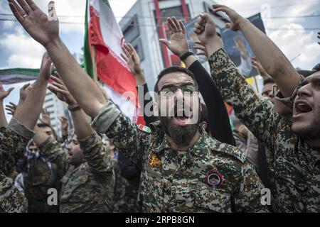 (190601) -- TEHRAN, June 1, 2019 -- Soldiers shout slogans during a rally to mark the al-Quds (Jerusalem) Day in downtown Tehran, Iran, on May 31, 2019. Hundreds of thousands of Iranians held nationwide rallies in support of the Palestinians to mark the al-Quds Day on Friday. ) IRAN-TEHRAN-QUDS DAY-RALLY AhmadxHalabisaz PUBLICATIONxNOTxINxCHN Stock Photo