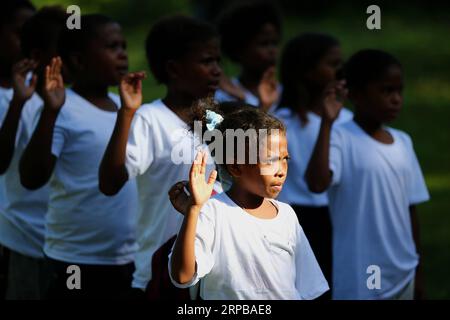 (190603) -- PAMPANGA PROVINCE, June 3, 2019 -- Children from the indigenous group Aeta attend class during the first day of classes in temporary classrooms of Diaz Elementary school in Pampanga Province, the Philippines, June 3, 2019. Temporary classrooms were set up after the Aeta community s classrooms were destroyed by the earthquake last April, as today marks the first day of new school year in the Philippines. ) PHILIPPINES-PAMPANGA PROVINCE-FIRST DAY OF SCHOOL ROUELLExUMALI PUBLICATIONxNOTxINxCHN Stock Photo