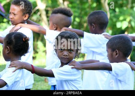 (190603) -- PAMPANGA PROVINCE, June 3, 2019 -- Children from the indigenous group Aeta attend class during the first day of classes in temporary classrooms of Diaz Elementary school in Pampanga Province, the Philippines, June 3, 2019. Temporary classrooms were set up after the Aeta community s classrooms were destroyed by the earthquake last April, as today marks the first day of new school year in the Philippines. ) PHILIPPINES-PAMPANGA PROVINCE-FIRST DAY OF SCHOOL ROUELLExUMALI PUBLICATIONxNOTxINxCHN Stock Photo