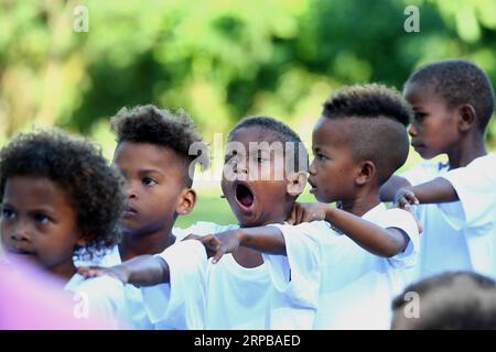 (190603) -- PAMPANGA PROVINCE, June 3, 2019 -- A boy from the indigenous group Aeta yawns as children attend class during the first day of classes in temporary classrooms of Diaz Elementary school in Pampanga Province, the Philippines, June 3, 2019. Temporary classrooms were set up after the Aeta community s classrooms were destroyed by the earthquake last April, as today marks the first day of new school year in the Philippines. ) PHILIPPINES-PAMPANGA PROVINCE-FIRST DAY OF SCHOOL ROUELLExUMALI PUBLICATIONxNOTxINxCHN Stock Photo