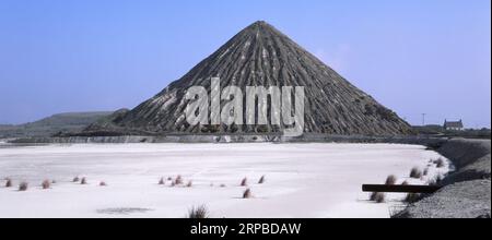 2002 historical archive photo of Carluddon Tip* a 'Cornish Pyramid,' mound of waste from china clay industry near St Austell with white slurry lake UK Stock Photo