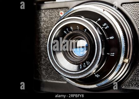 Vintage scale rangefinder camera on black Stock Photo