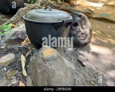 Traditional primitive Philippine style ground cooking using rocks and ...