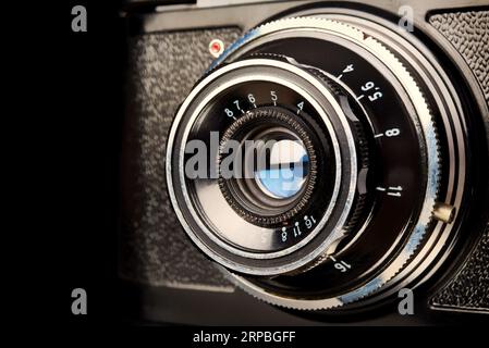 Vintage scale rangefinder camera on black Stock Photo