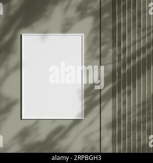 Blank picture frame hanging on the wall with shadow. Empty poster mockup for art display in sunlight. Minimal interior design. Stock Photo