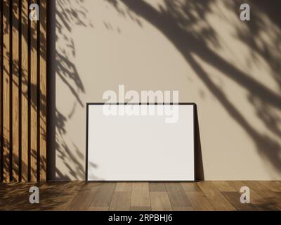 Frame mockup on wooden floor with white wall and leaves shadow Stock Photo