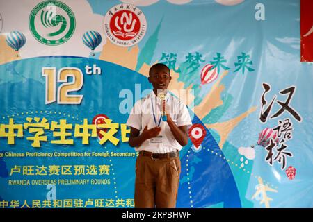 (190609) -- KIGALI, June 9, 2019 (Xinhua) -- A Rwandan student gives a speech in Chinese during the overseas preliminary rounds of the 12th Chinese Bridge Chinese Proficiency Competition for Foreign Secondary School Students, in Kigali, capital of Rwanda, June 9, 2019. Rwanda s secondary school students from different parts of the country participated in the competition in Kigali on Sunday. (Xinhua/Lyu Tianran) RWANDA-KIGALI-CHINESE LANGUAGE COMPETITION-SECONDARY SCHOOL PUBLICATIONxNOTxINxCHN Stock Photo