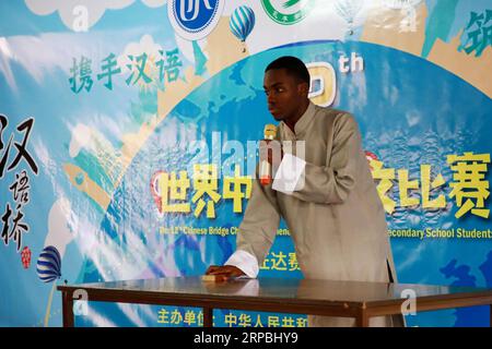 (190609) -- KIGALI, June 9, 2019 (Xinhua) -- A Rwandan student shows his talent during the overseas preliminary rounds of the 12th Chinese Bridge Chinese Proficiency Competition for Foreign Secondary School Students, in Kigali, capital of Rwanda, June 9, 2019. Rwanda s secondary school students from different parts of the country participated in the competition in Kigali on Sunday. (Xinhua/Lyu Tianran) RWANDA-KIGALI-CHINESE LANGUAGE COMPETITION-SECONDARY SCHOOL PUBLICATIONxNOTxINxCHN Stock Photo