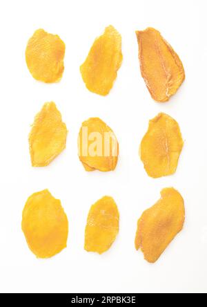 Slices of large sweet dried mangoes isolated on white. Stock Photo
