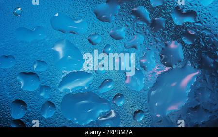 Water drops on a glass surface close up Stock Photo
