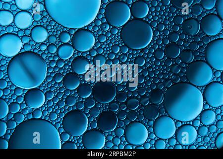 Macrophoto of oil droplets and bubbles on a water surface Stock Photo