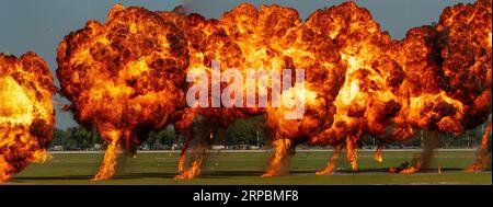 Series of explosions on the ground of napalm-like pyrotechnic material Stock Photo