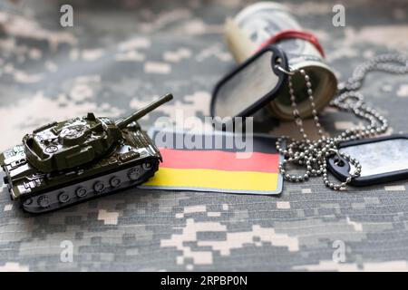 Amy camouflage uniform with flag on it, Germany Stock Photo