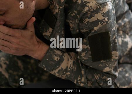 Portrait of middle aged sad, desperate military man. Disabled soldier suffering from depression psychological trauma. PTSD concept. Stock Photo