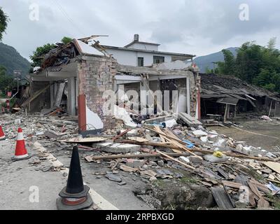 (190618) -- CHANGNING, June 18, 2019 (Xinhua) -- Photo taken on June 18, 2019 shows collapsed houses at Putao Village in Shuanghe Town, Changning County of Yibin City, southwest China s Sichuan Province. Twelve people died and another 125 were injured after a 6.0-magnitude earthquake hit Changning County Monday night, China s Ministry of Emergency Management said on Tuesday. (Xinhua/Chen Di) CHINA-SICHUAN-CHANGNING-EARTHQUAKE (CN) PUBLICATIONxNOTxINxCHN Stock Photo