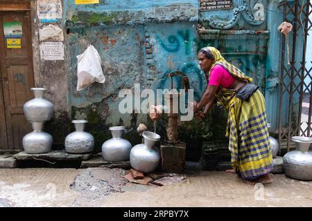 Dhaka, Dhaka, Bangladesh. 4th Sep, 2023. A woman collects drinking water from a deep tubewell on a street in Dhaka, Bangladesh. Safe drinking water is a regular crisis in the downtown areas of the city. About 80% of Dhaka city's total water demands are met through groundwater extraction with groundwater levels depleting at a rate of 2-3 meters per year, quickly exhausting this resource. Credit: ZUMA Press, Inc./Alamy Live News Stock Photo