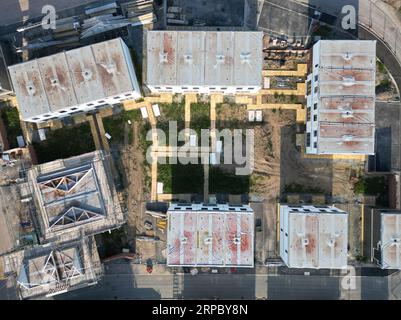 Aerial view of modular housing construction site ( Ilke Homes ) Hereford UK showing pitched roofing being added in September 2023 on brownfield site. Stock Photo