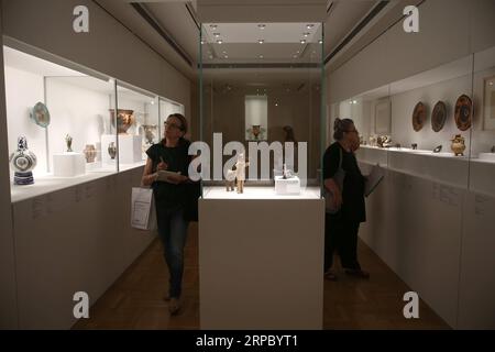 (190619) -- ATHENS, June 19, 2019 -- Visitors view works of art at the media preview of Picasso and Antiquity. Line and Clay at the Museum of Cycladic Art in Athens, Greece, June 19, 2019. A rare exhibition about Pablo Picasso and his inspiration from ancient Greek art is to open here at the Museum of Cycladic Art on Thursday. ) TO GO WITH Exhibition at Cycladic museum to explore Picasso s dialogue with ancient Greek art GREECE-ATHENS-MUSEUM OF CYCLADIC ART-PICASSO-EXHIBITION MariosxLolos PUBLICATIONxNOTxINxCHN Stock Photo