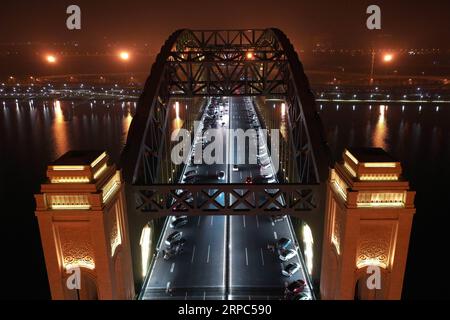 (190624) -- TAIYUAN, June 24, 2019 (Xinhua) -- Aerial photo taken on June 22, 2019 shows a night view of the Jinyang Bridge across the Fenhe River in Taiyuan, north China s Shanxi Province. (Xinhua/Yang Chenguang) CHINA-SHANXI-TAIYUAN-BRIDGES-NIGHT VIEWS (CN) PUBLICATIONxNOTxINxCHN Stock Photo