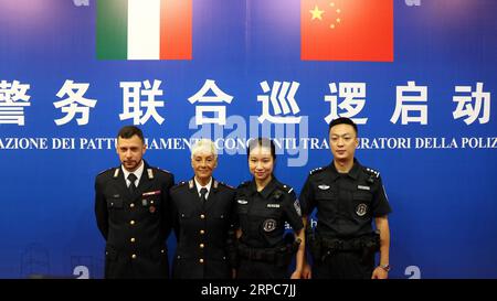 (190626) -- GUANGZHOU, June 26, 2019 -- Chinese and Italian police officers pose for a group photo during the launching ceremony of the joint patrol between Chinese and Italian police held in Guangzhou, capital of south China s Guangdong Province, June 26, 2019. Italian police officers on Monday began patrolling tourist sites in China, with their local counterparts, after a launching ceremony held in Beijing. The joint patrol, the third such exercise between Chinese and Italian police in China, will last until July 5 in four cities: Beijing, Shanghai, Chongqing and Guangzhou. ) CHINA-GUANGDONG Stock Photo