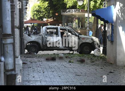 (190628) -- BEIJING, June 28, 2019 -- Photo taken on June 27, 2019 shows the site of a bomb attack in Tunis, Tunisia. Two members of Tunisian security forces were injured Thursday in a suicide bomb attack on a police vehicle parked on Habib Bourguiba Street in central Tunis, Xinhua said. Further investigation is underway. ) XINHUA PHOTOS OF THE DAY AdelexEzzine PUBLICATIONxNOTxINxCHN Stock Photo
