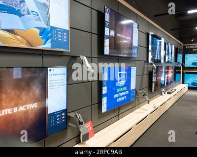 Television flat screens on shelves in a store. Copenhagen, Denmark, September 2, 2023. Stock Photo