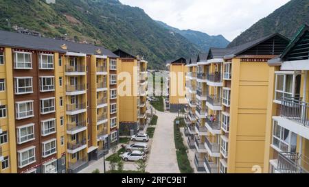 (190628) -- KUNMING, June 28, 2019 -- Aerial photo taken on June 24, 2019 shows buildings at a resettlement site for people of Lisu ethnic group in Daxingdi Town, Lisu Autonomous Prefecture of Nujiang, southwest China s Yunnan Province. Lisu people have been relocated to a new community from unlivable mountain areas thanks to the poverty alleviation policy by local government. Zhiguo minorities are special members of China s 56 ethnic groups. The term Zhiguo refers to minority groups who, before modernization, had lived in relative isolation and skipped the transition period associated with fe Stock Photo