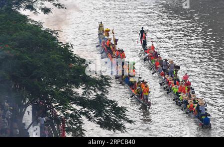 (190630) -- GUANGZHOU, June 30, 2019 -- Rowers paddle the dragon boats in Chebei, Guangzhou, south China s Guangdong province, June 5, 2019. Chebei is an ancient village with a history of more than 1,000 years and over 200,000 permanent residents in Guangzhou, south China s Guangdong province. The Chebei Village Dragon Boat is listed as the intangible cultural heritage of Guangzhou. The Dragon Boat Festival consists of many key steps which has been preserved integrally. On the eighth day of the fourth lunar month, the day of Lifting Dragon, dragon boats in Chebei, which has been covered by mud Stock Photo