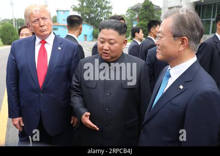 (190630) -- PANMUNJOM, June 30, 2019 -- Kim Jong Un (C), top leader of the Democratic People s Republic of Korea (DPRK), U.S. President Donald Trump (L) and South Korean President Moon Jae-in meet at the truce village of Panmunjom on June 30, 2019. NEWSIS) DONALD TRUMP-KIM JONG UN-MOON JAE-IN-MEETING WangxJingqiang PUBLICATIONxNOTxINxCHN Stock Photo