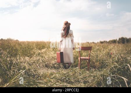 surreal woman with suitcase decides to leave for her journey, concept of freedom Stock Photo