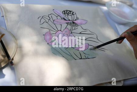 (190701) -- LOS ANGELES, July 1, 2019 -- A participant paints during the Summer Family Festival 2019 in Los Angeles, the United States, June 30, 2019. The festival held in Storrier Stearns Japanese Garden features art and music from China, Japan and South Korea. ) U.S.-LOS ANGELES-SUMMER FAMILY FESTIVAL LixYing PUBLICATIONxNOTxINxCHN Stock Photo