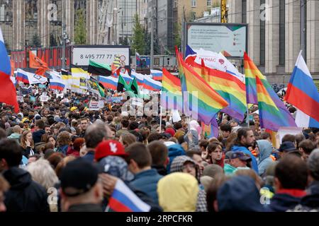 Moscow, Russia, August 10, 2019: Protesters with placards. Protest on Akademika Sakharov Avenue in Moscow. people at a rally with lgbt flags Stock Photo