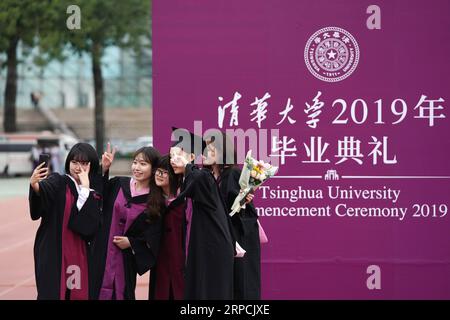 (190707) -- BEIJING, July 7, 2019 -- Graduates take selfies during the 2019 commencement ceremony of Tsinghua University held in Beijing, capital of China, July 7, 2019. Over 3,000 graduates attended the ceremony on Sunday. ) CHINA-BEIJING-TSINGHUA UNIVERSITY-GRADUATION (CN) JuxHuanzong PUBLICATIONxNOTxINxCHN Stock Photo