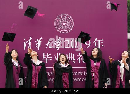 (190707) -- BEIJING, July 7, 2019 -- Graduates throw their caps in the air as they pose for a group photo during the 2019 commencement ceremony of Tsinghua University held in Beijing, capital of China, July 7, 2019. Over 3,000 graduates attended the ceremony on Sunday. ) CHINA-BEIJING-TSINGHUA UNIVERSITY-GRADUATION (CN) JuxHuanzong PUBLICATIONxNOTxINxCHN Stock Photo