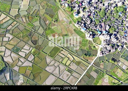 (190708) -- BEIJING, July 8, 2019 -- Aerial photo taken on April 16, 2019 shows a spring scenery on the bank of Lianxi River in Daoxian County, central China s Hunan Province. Located in central China, Hunan Province is well-known for its varied topography. It abuts the Dongting Lake to the north, and the east, south and west sides of the province are surrounded by mountains, with Wuling and Xuefeng Mountains to the west, Nanling Mountain to the south, Luoxiao and Mufu Mountains to the east. The Xiangjiang, Zijiang, Yuanjiang and Lishui Rivers converge on the Yangtze River at the Dongting Lake Stock Photo