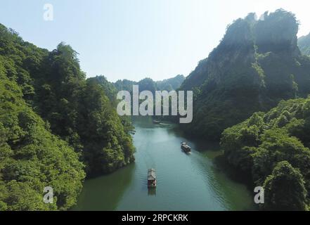 (190708) -- BEIJING, July 8, 2019 -- Aerial photo taken on June 1, 2019 shows a view of the Baofeng Lake in the Wulingyuan Scenic Area in Zhangjiajie, central China s Hunan Province. Located in central China, Hunan Province is well-known for its varied topography. It abuts the Dongting Lake to the north, and the east, south and west sides of the province are surrounded by mountains, with Wuling and Xuefeng Mountains to the west, Nanling Mountain to the south, Luoxiao and Mufu Mountains to the east. The Xiangjiang, Zijiang, Yuanjiang and Lishui Rivers converge on the Yangtze River at the Dongti Stock Photo