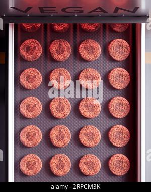 Vegan Meat Factory Production Line with Plant-Based Burger Patties and Leaf Sign Stock Photo