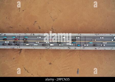 (190709) -- CHANGSHA, July 9, 2019 -- Aerial photo taken on July 9, 2019 shows the Juzizhou Islet Bridge over the flooded Xiangjiang River in Changsha, central China s Hunan Province. Hunan hydrology and water resources investigation bureau issued a red alert for flood on Tuesday. As of 3 p.m. Tuesday, the water level of Xiangjiang River in Changsha has exceeded the alert level. The Juzizhou Islet scenic spot, located in Xiangjiang River, has closed for safety. ) CHINA-HUNAN-CHANGSHA-FLOOD-RED ALERT (CN) LixGa PUBLICATIONxNOTxINxCHN Stock Photo