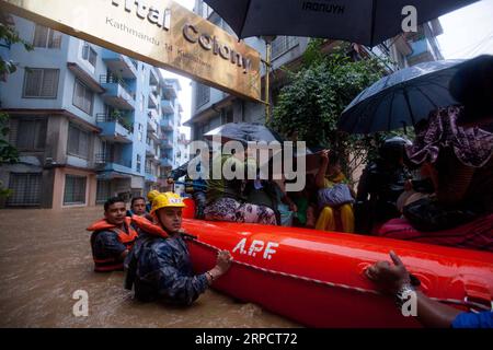 (190712) -- KATHMANDU, July 12, 2019 -- Nepalese army personnel rescue local people after a heavy rainfall in Kathmandu, Nepal, July 12, 2019. Nepal was hit by heavy rainfall that caused floods and landslides in many places. ) NEPAL-KATHMANDU-FLOOD-RESCUE sulavxshrestha PUBLICATIONxNOTxINxCHN Stock Photo