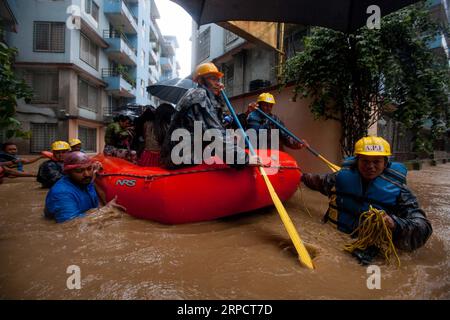 (190712) -- KATHMANDU, July 12, 2019 -- Nepalese army personnel rescue local people after a heavy rainfall in Kathmandu, Nepal, July 12, 2019. Nepal was hit by heavy rainfall that caused floods and landslides in many places. ) NEPAL-KATHMANDU-FLOOD-RESCUE sulavxshrestha PUBLICATIONxNOTxINxCHN Stock Photo