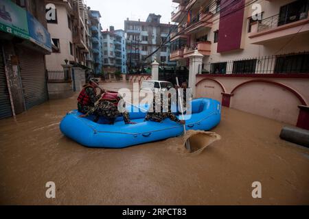 (190712) -- KATHMANDU, July 12, 2019 -- Nepalese army personnel rescue local people after a heavy rainfall in Kathmandu, Nepal, July 12, 2019. Nepal was hit by heavy rainfall that caused floods and landslides in many places. ) NEPAL-KATHMANDU-FLOOD-RESCUE sulavxshrestha PUBLICATIONxNOTxINxCHN Stock Photo