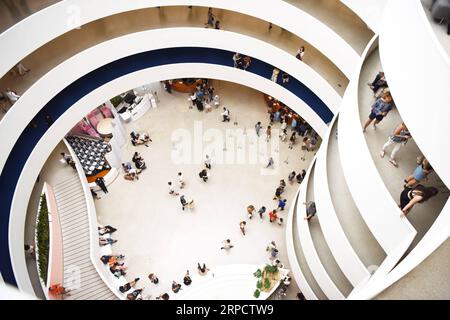 (190713) -- NEW YORK, July 13, 2019 -- People visit the Guggenheim Museum in New York, the United States, July 12, 2019. The Solomon R. Guggenheim Museum in New York City, often referred to as The Guggenheim, has been added to UNESCO s World Heritage List. The museum is among eight buildings in the United States that were inscribed on the list under the title of The 20th-Century Architecture of Frank Lloyd Wright. The announcement was made during the 43rd Session of the World Heritage Committee held in Baku, Azerbaijan from June 30 to July 10. ) U.S.-NEW YORK-GUGGENHEIM MUSEUM-WORLD HERITAGE L Stock Photo