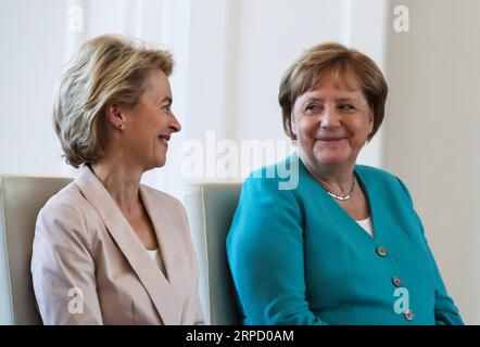 (190717) -- BERLIIN, July 17, 2019 -- German Chancellor Angela Merkel (R) and outgoing German Defense Minister Ursula von der Leyen attend a ceremony for the appointment of German Defense Minister at the Bellevue Palace in Berlin, capital of Germany, July 17, 2019. The leader of the German ruling party Christian Democratic Union (CDU) , Annegret Kramp-Karrenbauer, was appointed new German Minister for Defense on Wednesday. ) GERMANY-BERLIIN-KRAMP-KARRENBAUER-DEFENSE MINISTER-INAUGURATION ShanxYuqi PUBLICATIONxNOTxINxCHN Stock Photo