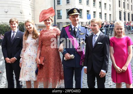 (190722) -- BRUSSELS, July 22, 2019 -- King Philippe (3rd R), Queen Mathilde (3rd L), and their children Crown Princess Elisabeth (2nd L), Prince Gabriel (1st L), Princess Eleonore (1st R), and Prince Emmanuel (2nd R) attend the Belgian National Day celebrations in Brussels, Belgium, July 21, 2019. To mark the Belgian National Day, a large parade was organized on Sunday in the center of Brussels. ) BELGIUM-BRUSSELS-NATIONAL DAY-CELEBRATION WangxXiaojun PUBLICATIONxNOTxINxCHN Stock Photo